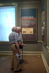 HCHS members Ken and Polly viewing one of the many displays at the Lincoln Cottage.