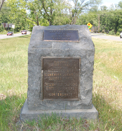In the median near the Brook Run shopping center is the marker for the Jefferson Davis Highway, erected in June 1927.