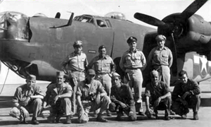 Sheppard (kneeling, third from the left) poses with his regular flight crew.