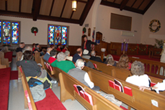 Ben Gregory discusses the history of Calvary United Methodist Church with HCHS members at their December 2010 meeting.