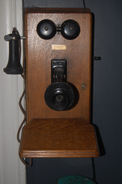 Wall phone with hand crank.