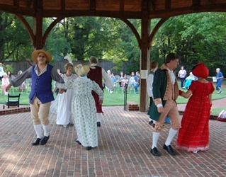 Colonial Dance Company performing in gazebo.