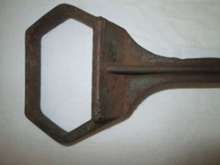 Smaller 4-inch wide section of iron item.