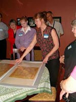 HCHS members viewing Beth Elon blueprints.