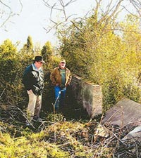 Damage caused by storms can be seen in west wall of Randolf Cemetery, Henrico County, Virginia.