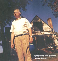Norwood Nuckols next to his ancestry home, Henrico County, Virginia.