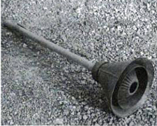 Pictured here is a household implement.  It is about 3 feet long.  The end on the right is metal, and the handle is wood.  Answer in our next newsletter.