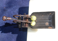 Antique cherry pitter.