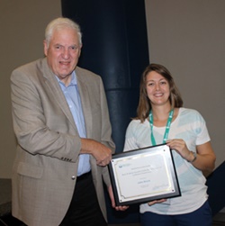 John Shuck displays his Brink Award.  With him is Kate Scott, who started the nomination process.