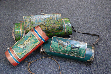 Three ovoid tin containers.
